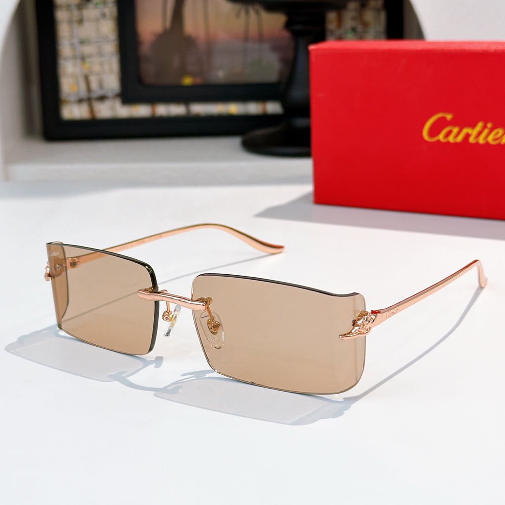 Cartier sunglasses with tan gradient lenses, rose-gold metal frame, rectangular