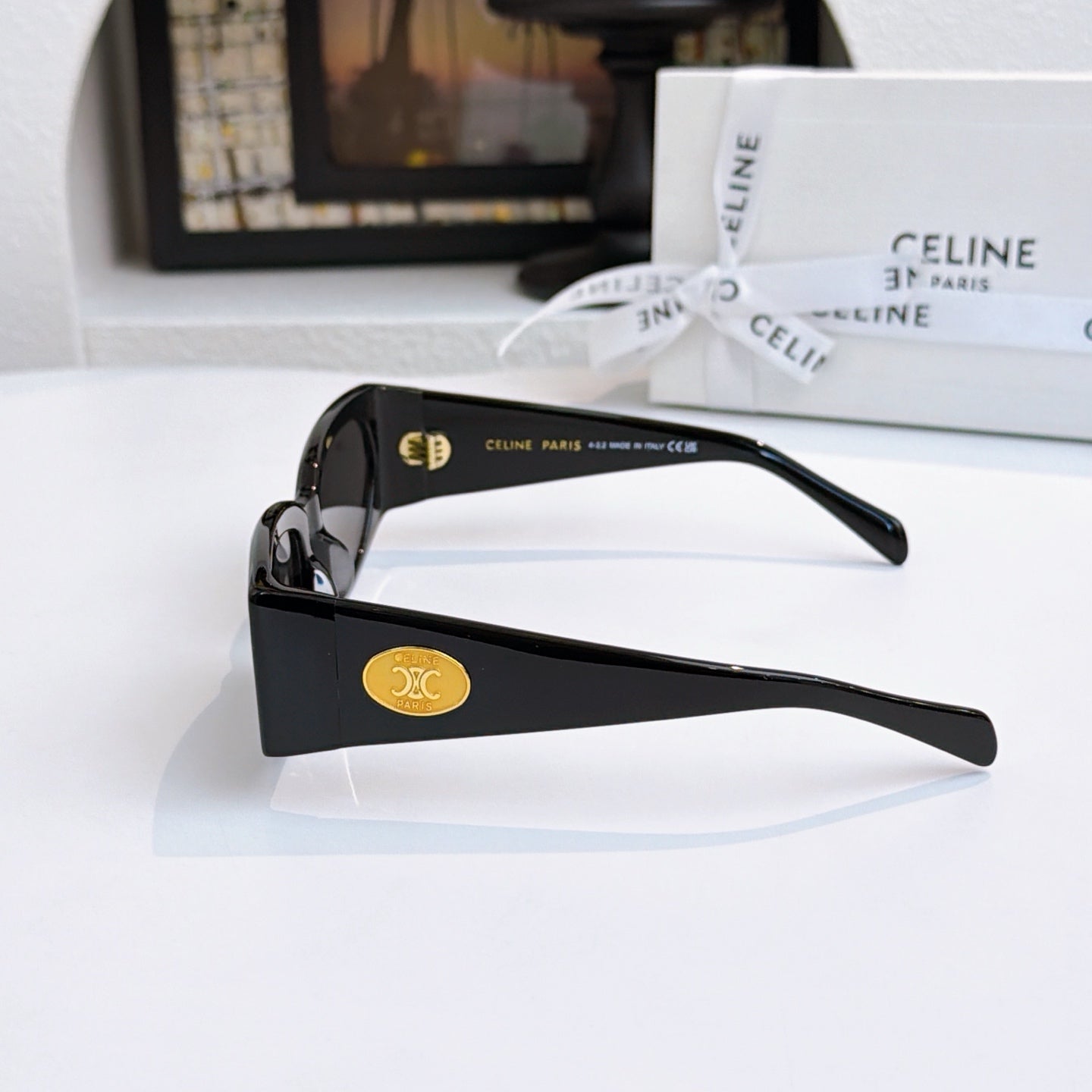 Celine black sunglasses with dark lenses, side view