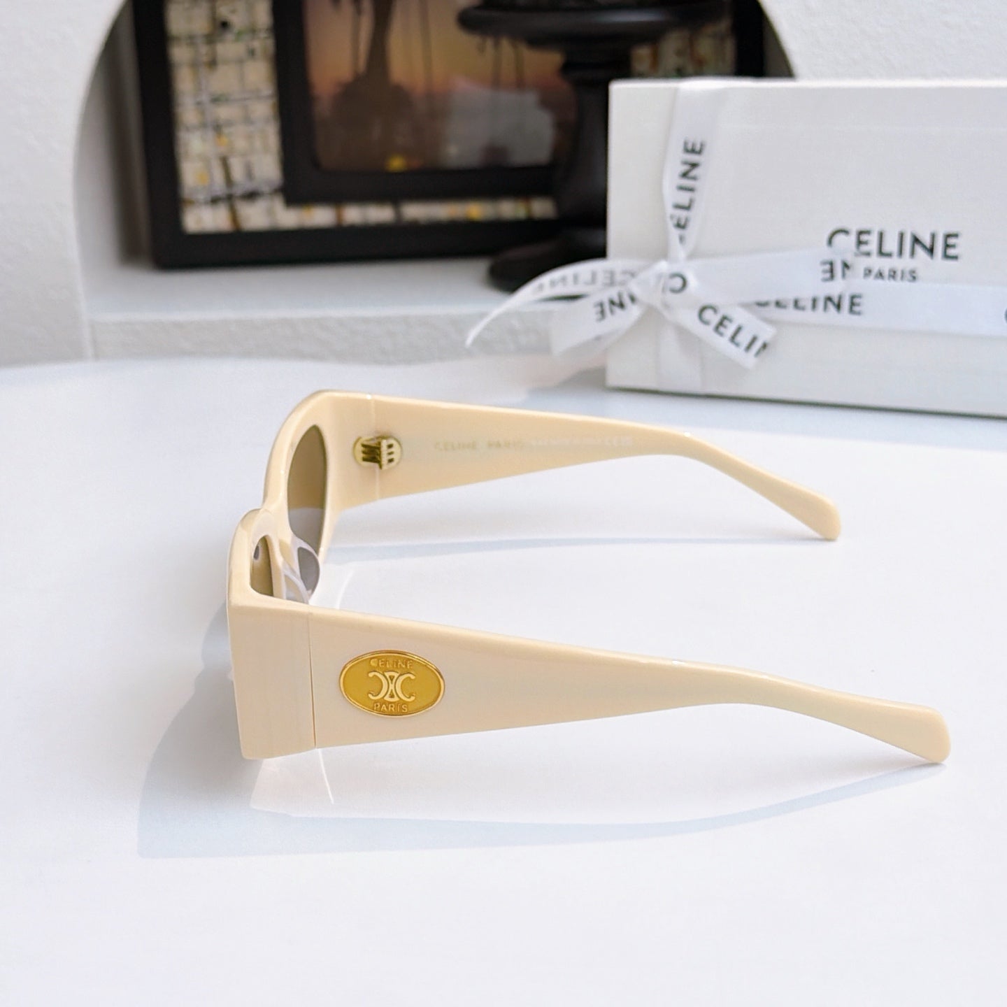Celine cream sunglasses with brown lenses, side view