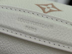 Louis Vuitton embossed monogram on cream leather edge with stitched detailing