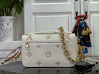 Louis Vuitton crossbody bag front view, cream monogram flap with gold chain strap