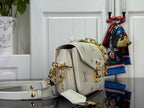 Louis Vuitton crossbody bag, side view with adjustable light gray strap and gold hardware