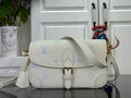 Louis Vuitton monogram shoulder bag with flap buckle and crossbody strap, cream/blue