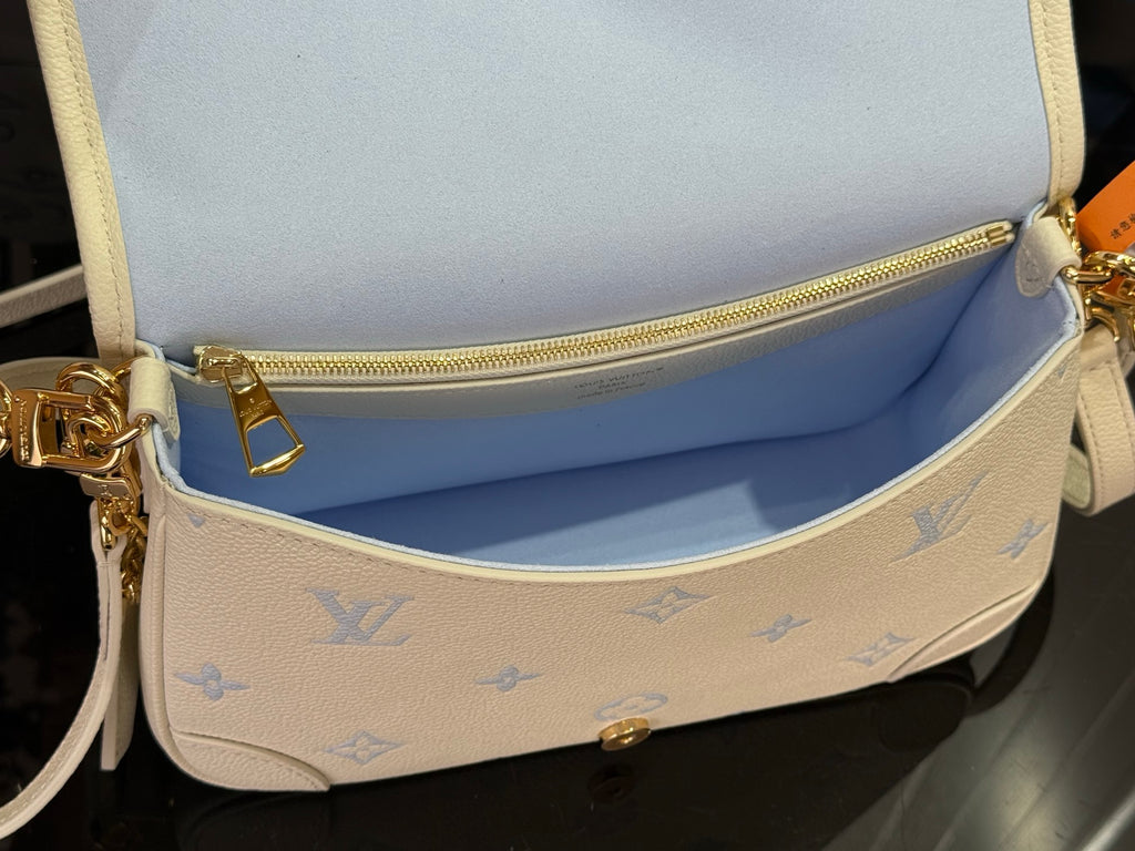 Louis Vuitton monogram mini bag with open top and zipper pocket, cream/blue