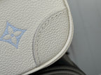 Louis Vuitton monogram leather edge detail on white bag, blue pattern