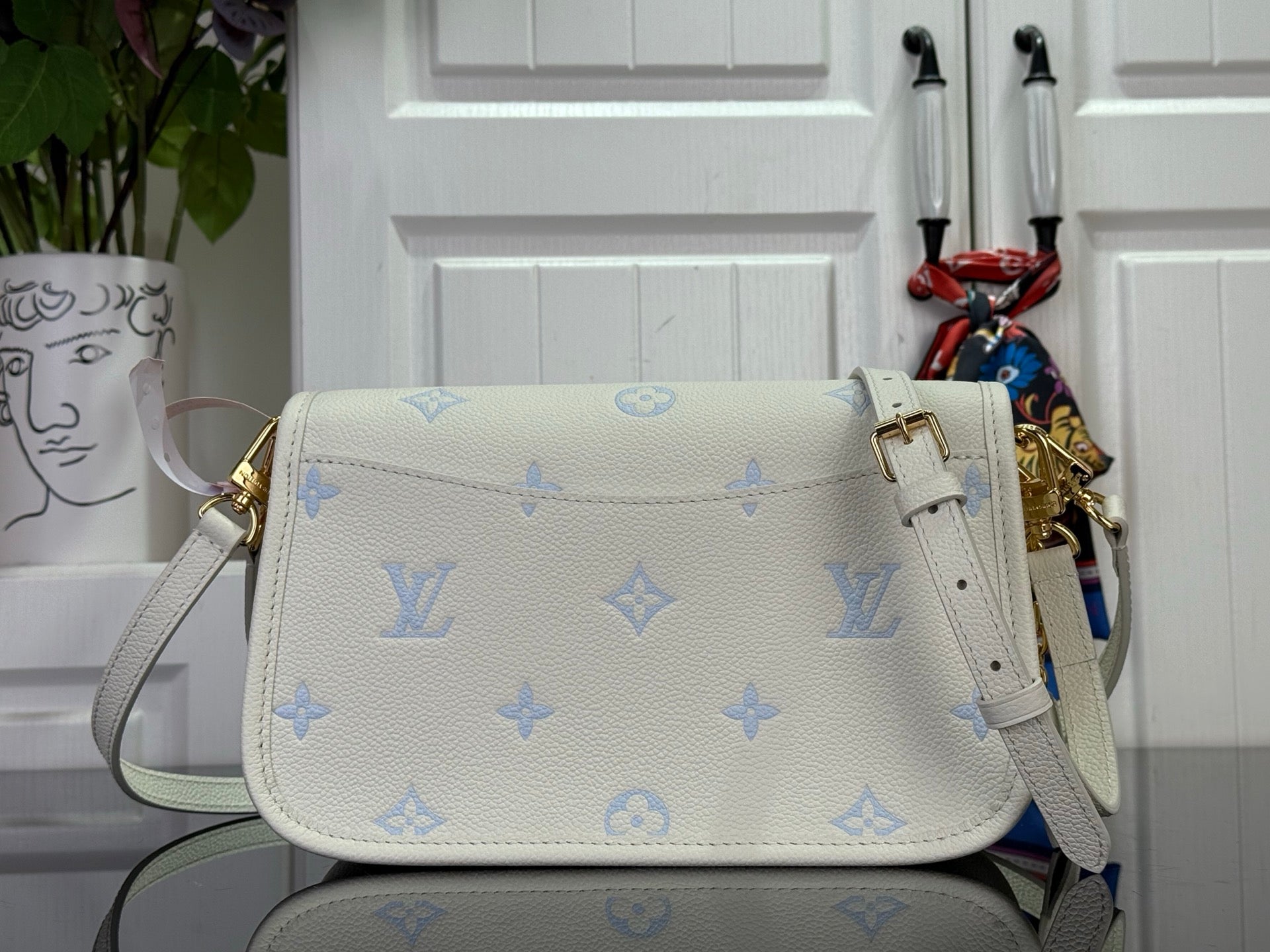 Louis Vuitton monogram crossbody bag with front flap and detachable strap, cream/blue