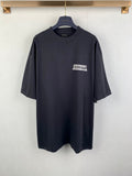 Balenciaga dark short-sleeve T-shirt with small chest logo patch