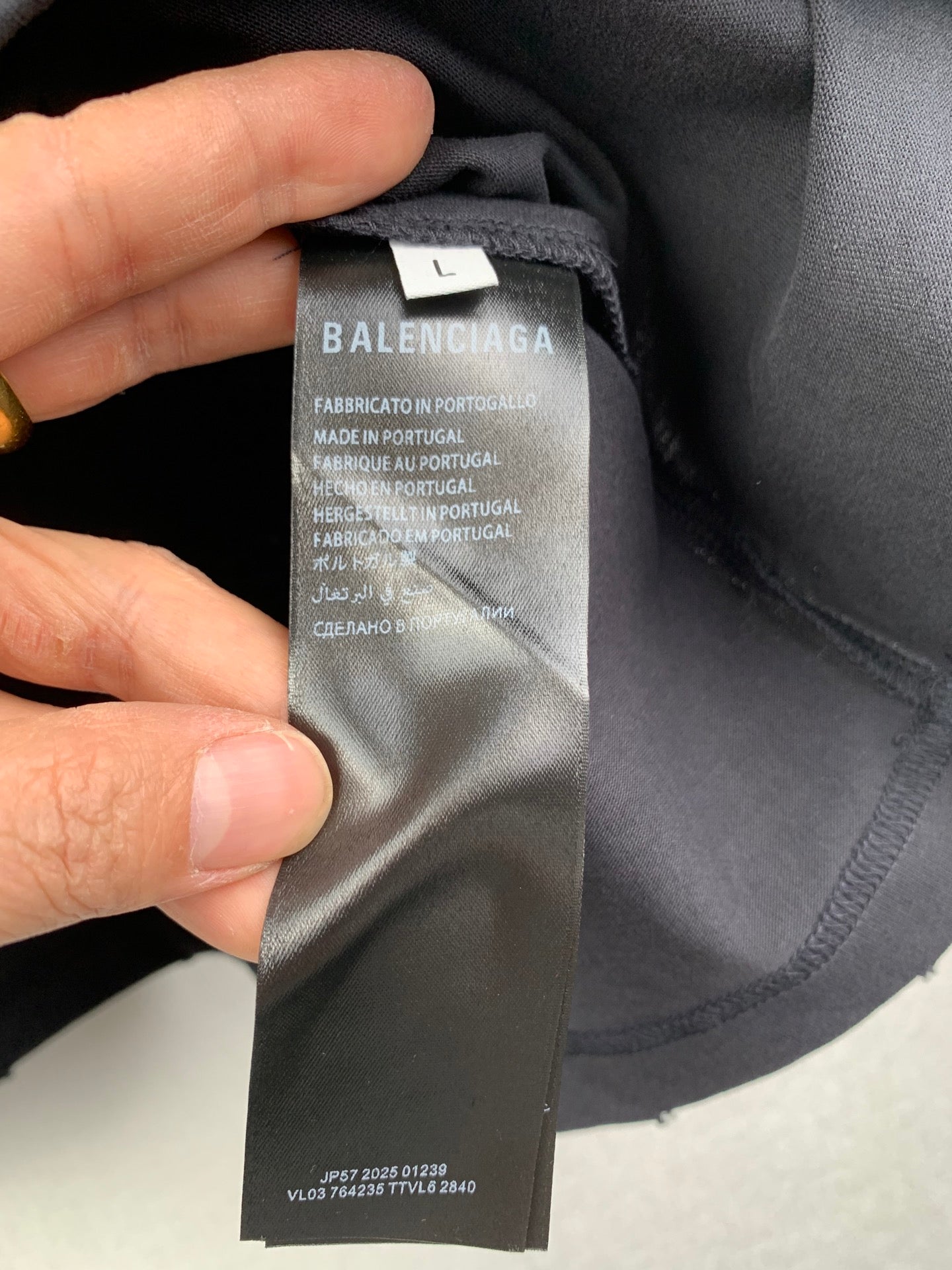 Dark short garment neckline with BALENCIAGA size label tag