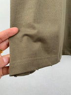 Balenciaga T-shirt hem in olive with stitched bottom edge and slight fabric wrinkle