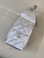 Chanel quilted chain crossbody bag in silver tone, flap-style front with logo charm