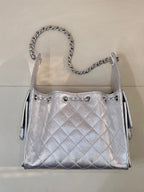 Chanel quilted chain-strap shoulder bag in silver tone, front view with drawcord closures