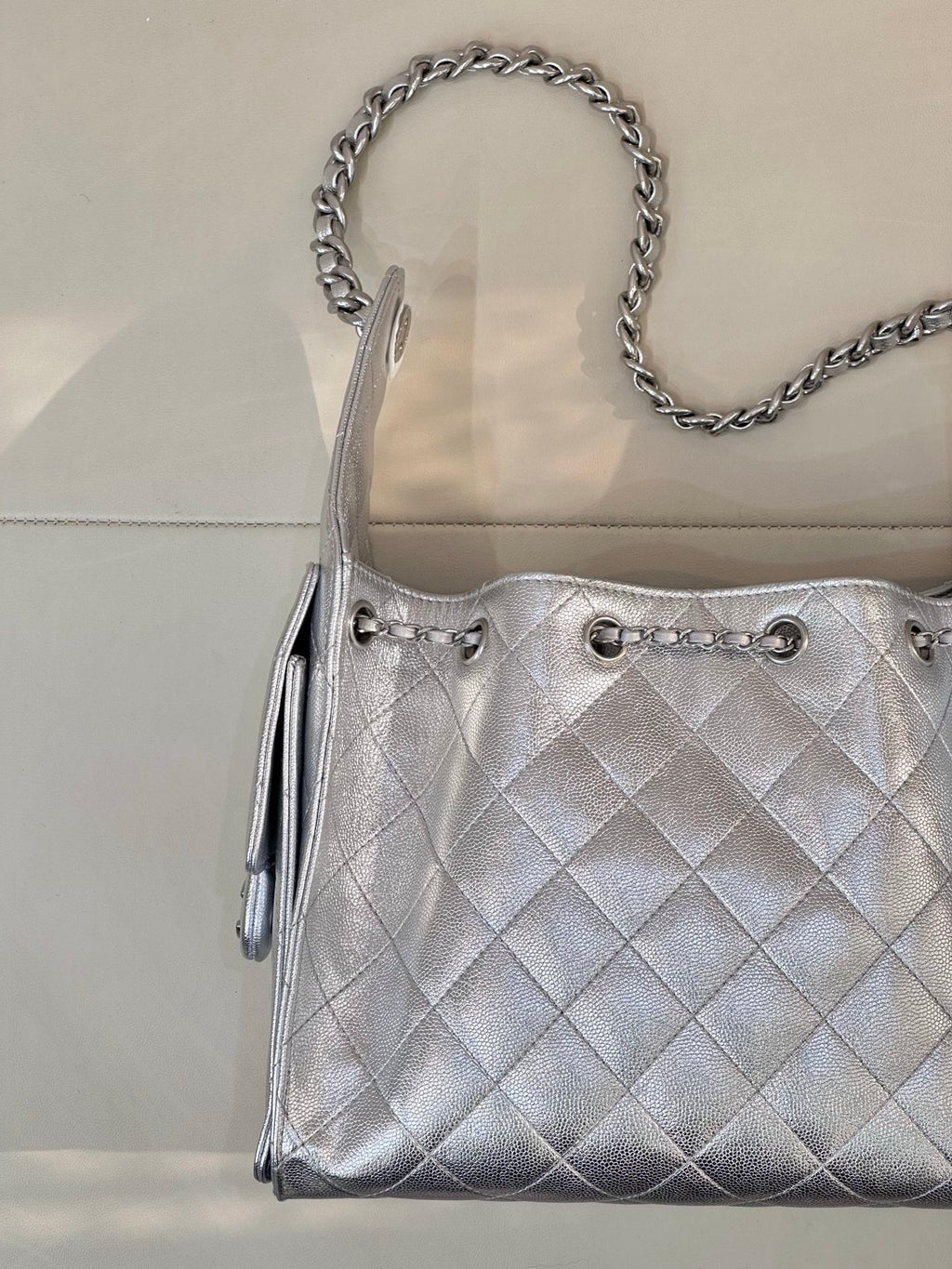 Chanel quilted chain-strap shoulder bag in silver tone, front pocket details and quilted pattern