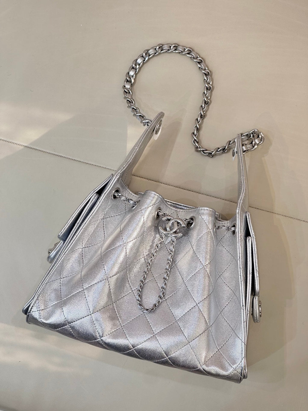 Chanel quilted chain-strap shoulder bag in silver tone, structured top with chain handle