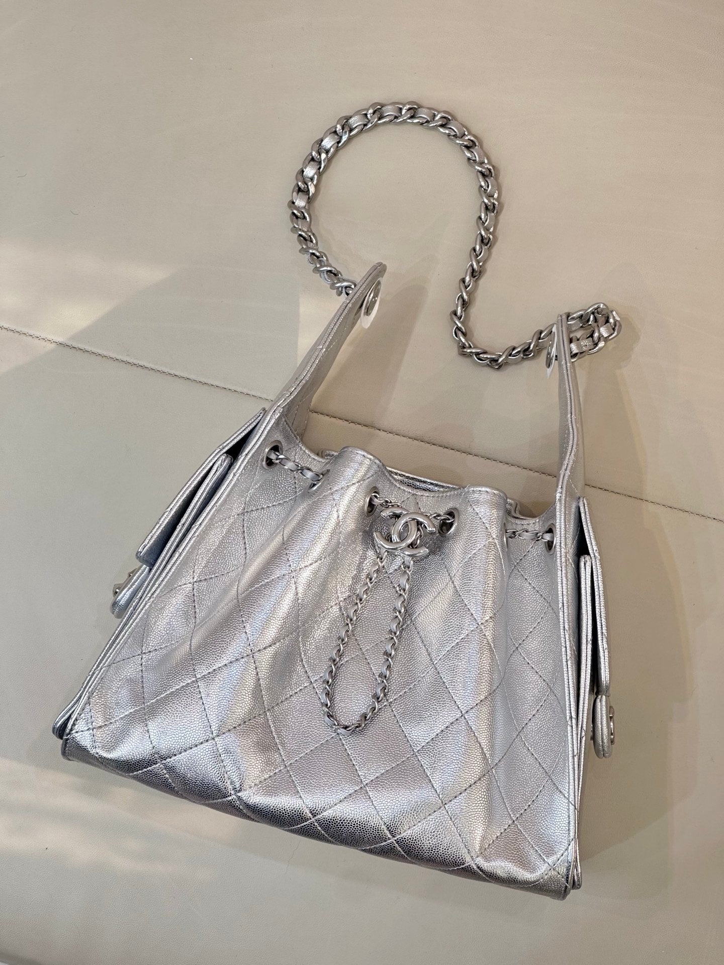 Chanel quilted chain-strap shoulder bag in silver tone, structured top with chain handle
