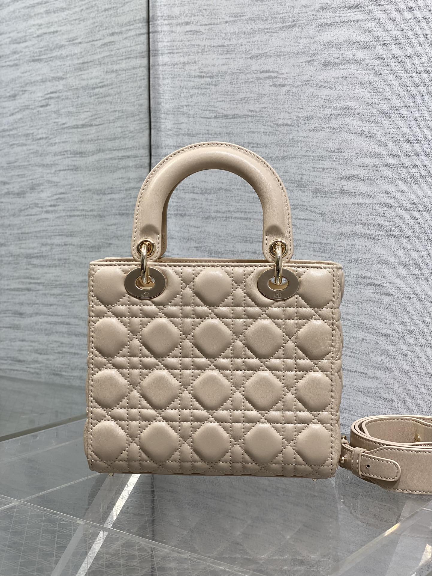 Dior quilted beige mini handbag with top handles and textured diamond stitching