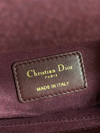 Burgundy leather label reading Christian Dior Paris, Made in Italy