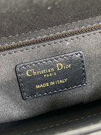 Close-up of interior label: Christian Dior Paris, Made in Italy on gray lining
