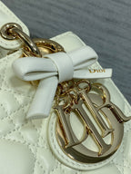 White leather handbag bow with gold-tone Dior charm and gold hardware