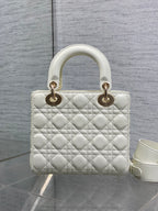 White quilted handbag with two top handles and gold-tone hardware
