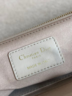 Light pink handbag leather patch label reading "Christian Dior" MADE IN"