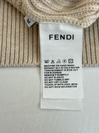 Fendi care label on cream knit sweater with washing instructions