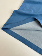 Blue T-shirt fabric underside with layered fold