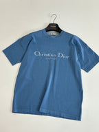 Blue short-sleeve T-shirt with Christian Dior logo, laid flat
