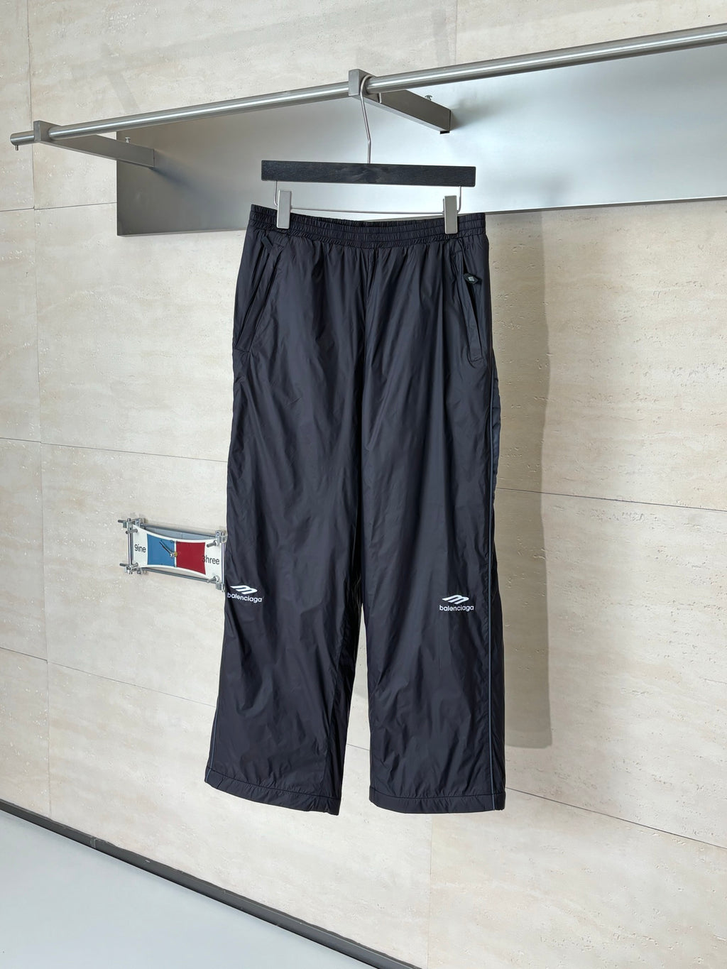 Balenciaga black drawstring wide-leg pants with elastic waistband and logo patch
