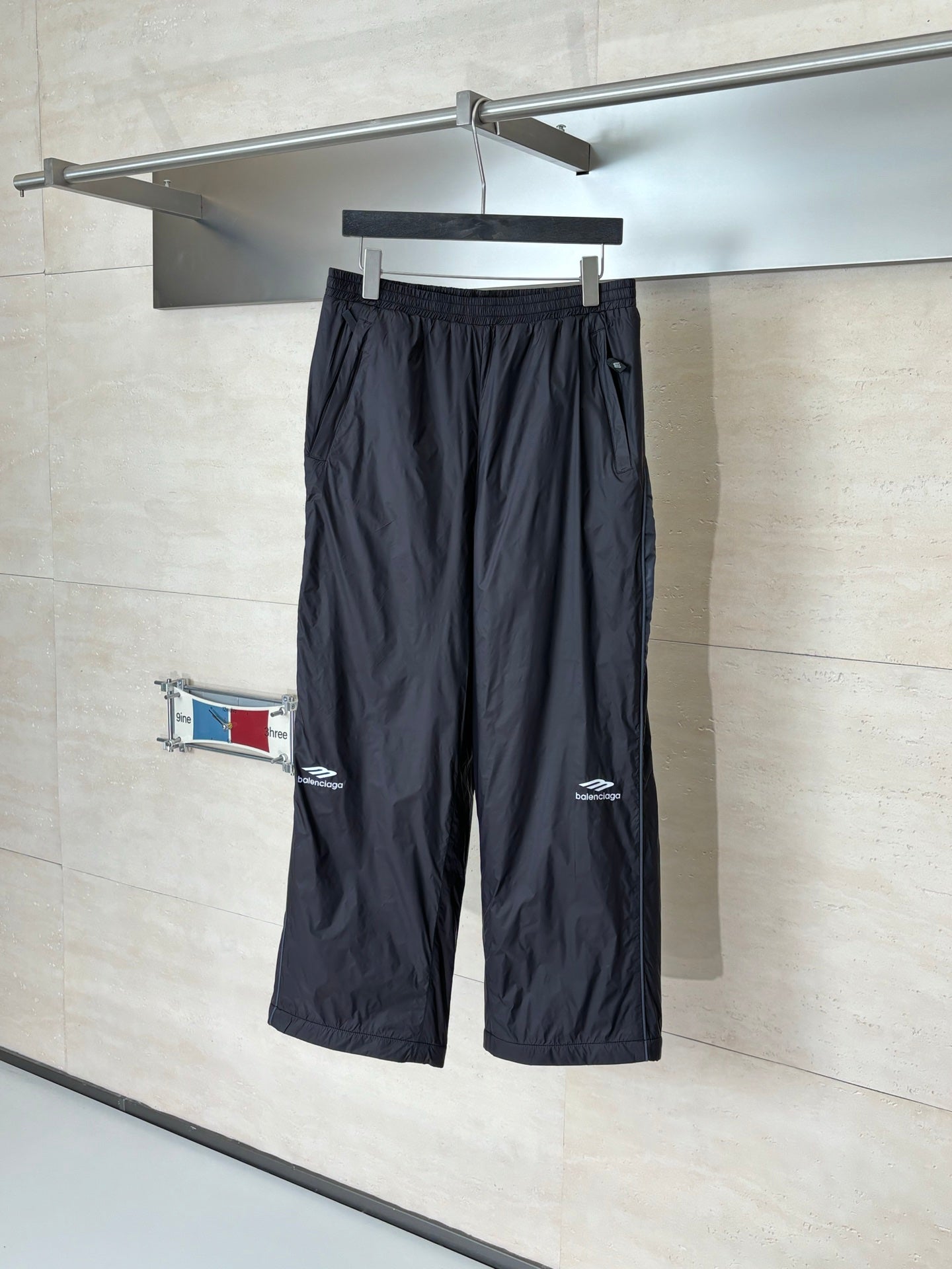 Balenciaga black drawstring wide-leg pants with elastic waistband and logo patch
