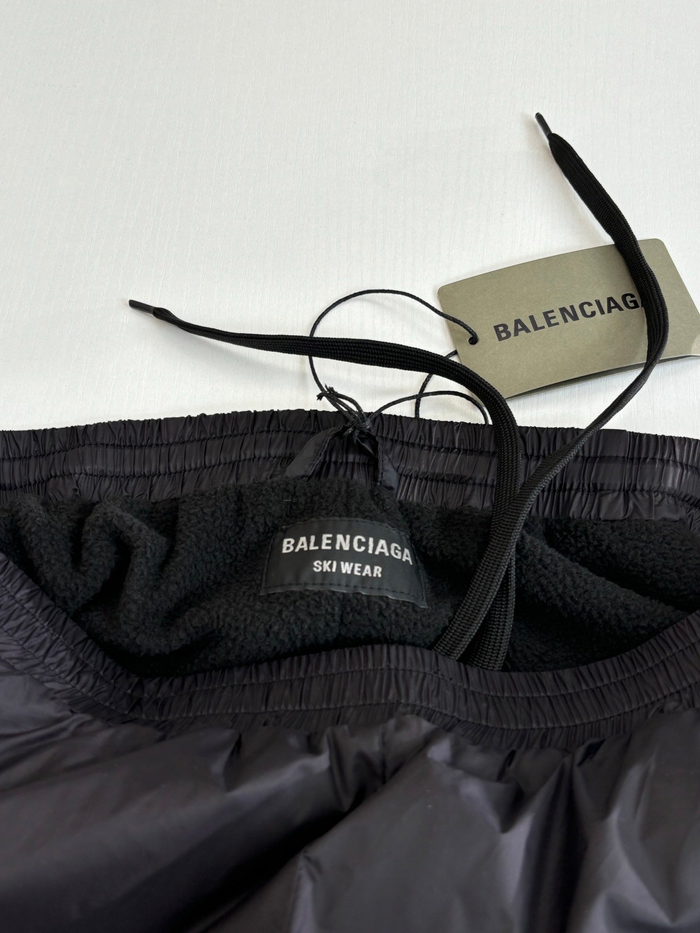 Balenciaga ski wear pants with elastic waistband, inner label, and black drawstrings