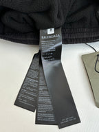 Balenciaga pants care and size tags on black elastic waistband