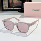 MiuMiu glasses with light pink frames and pink tinted lenses, front view