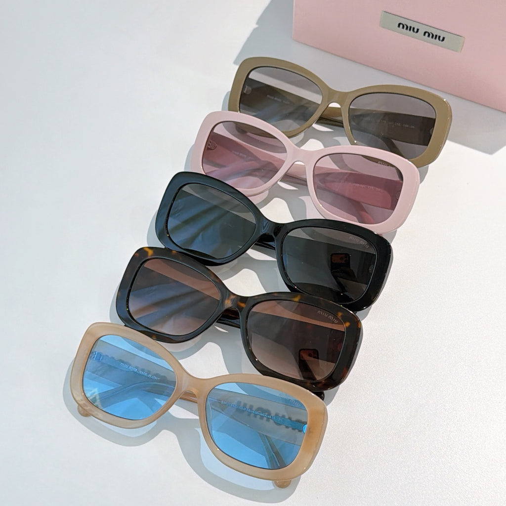 MiuMiu sunglasses group with tan, black, and pink frames and tinted lenses.