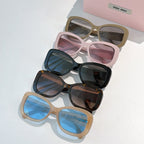 MiuMiu sunglasses group with tan, black, and pink frames and tinted lenses.