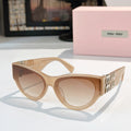 MiuMiu cat-eye sunglasses with tan frames and light brown tinted lenses