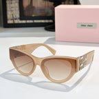 MiuMiu cat-eye sunglasses with tan frames and light brown tinted lenses