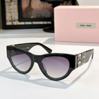 MiuMiu cat-eye sunglasses with dark frames and purple tinted lenses