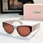 MiuMiu cat-eye sunglasses with pale pink frames and amber tinted lenses