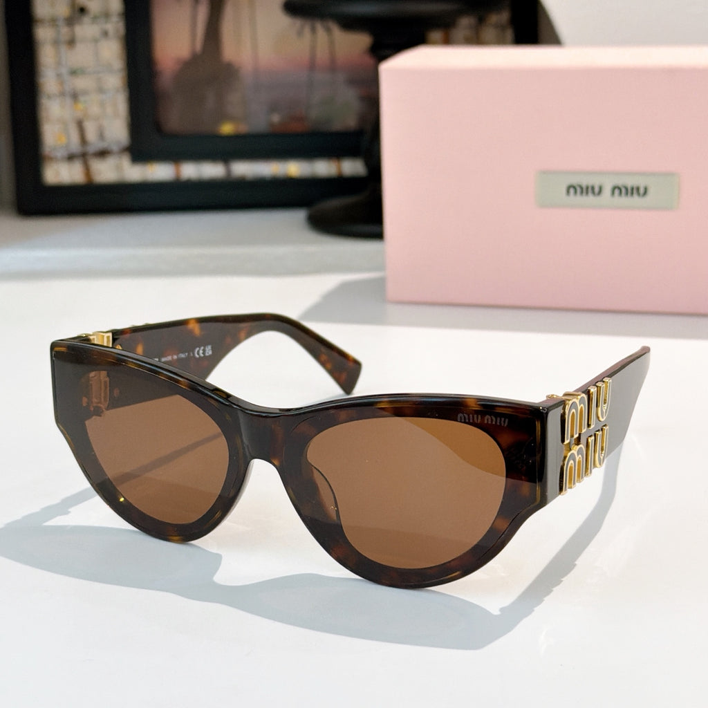 MiuMiu cat-eye sunglasses with black frames and dark brown tinted lenses