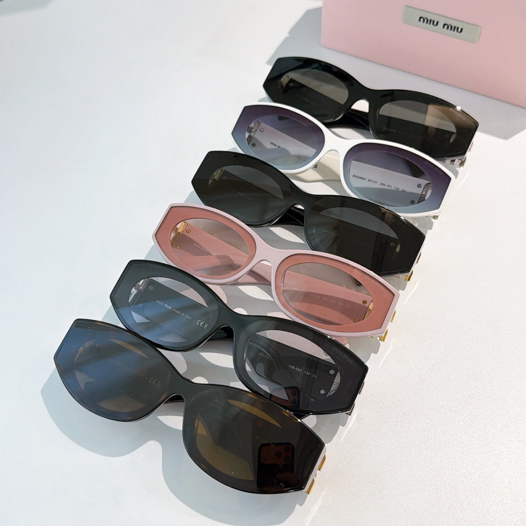 Assorted sunglasses with tinted lenses in black, white, blush, and dark frames