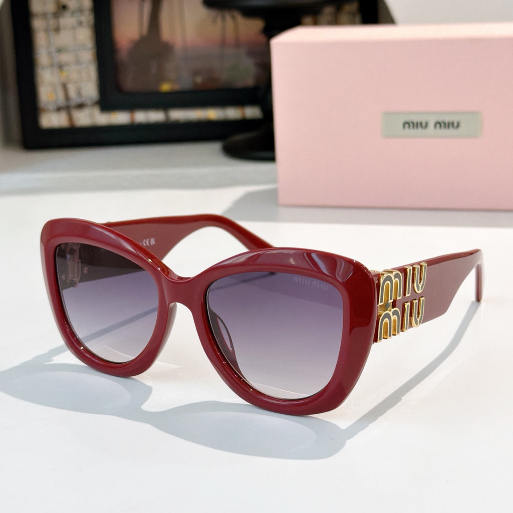 MiuMiu cat-eye sunglasses with red frames and purple tinted lenses, gold logo arms