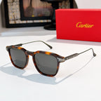 Sunglasses with tortoiseshell frame and dark smoke lenses, gold-tone temple accents.
