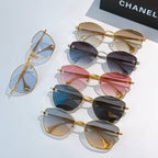 Set of gold-framed cat-eye glasses with clear, blue, pink, and dark lenses