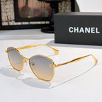 Gold-rim cat-eye sunglasses with gradient amber lenses and slim metal arms