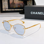 Gold-rim cat-eye sunglasses with light blue-tinted lenses and slim arms
