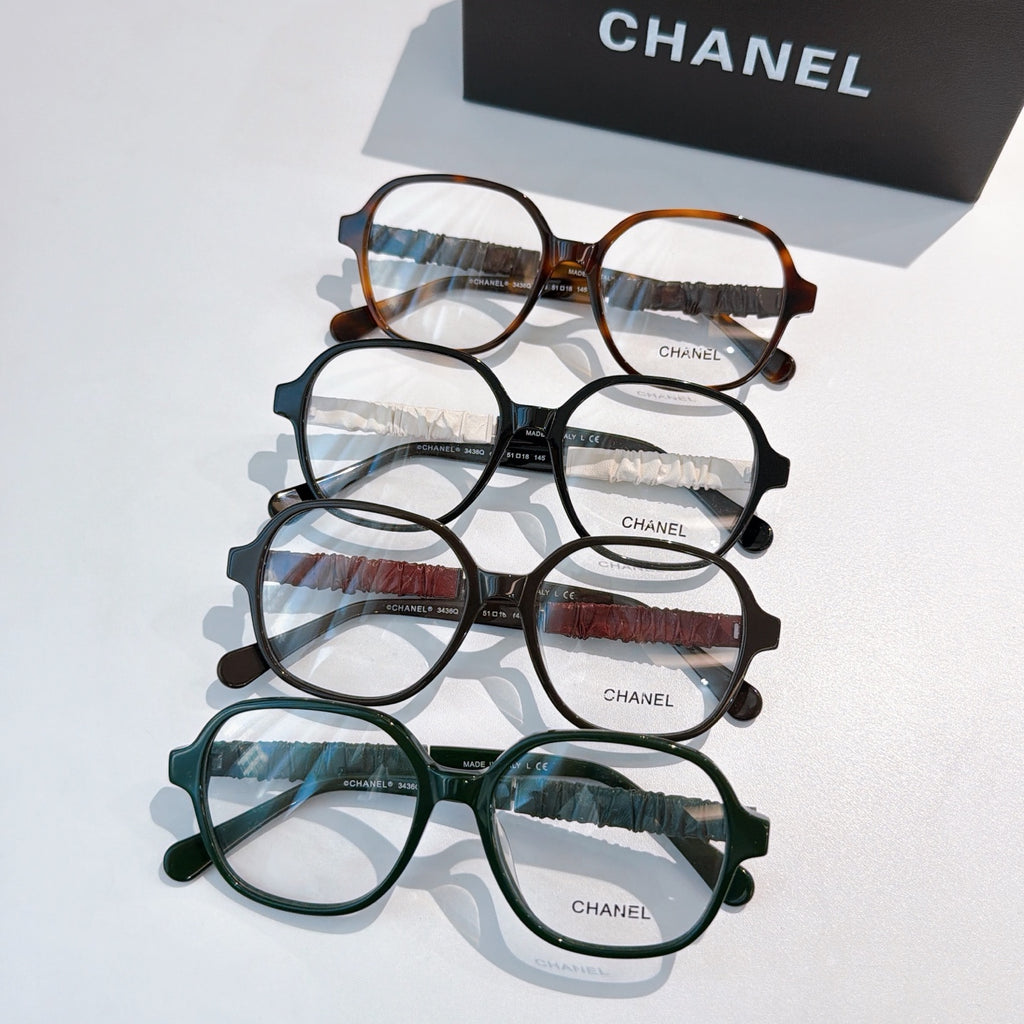 Chanel eyeglasses set with mixed frames in brown, black, maroon, and green.