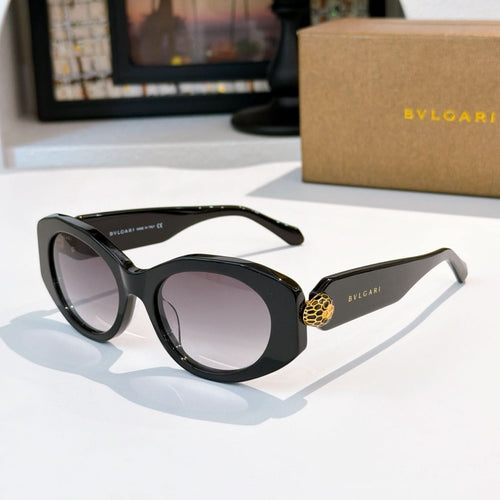 Black Bvlgari round-frame sunglasses with gold logo detail on the temple