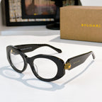 Black Bvlgari cat-eye sunglasses with gold logo detail on the temple