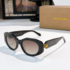 Dark brown Bvlgari cat-eye sunglasses with gold logo detail and neutral tinted lenses