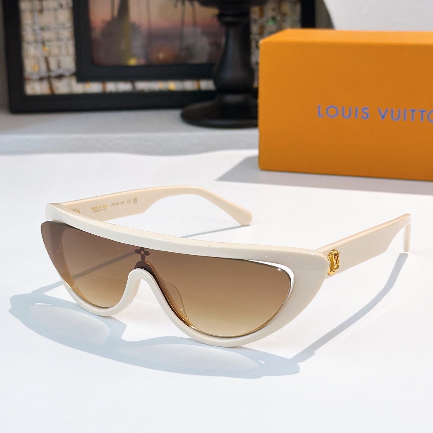 Louis Vuitton sunglasses with white frame and brown tinted lenses